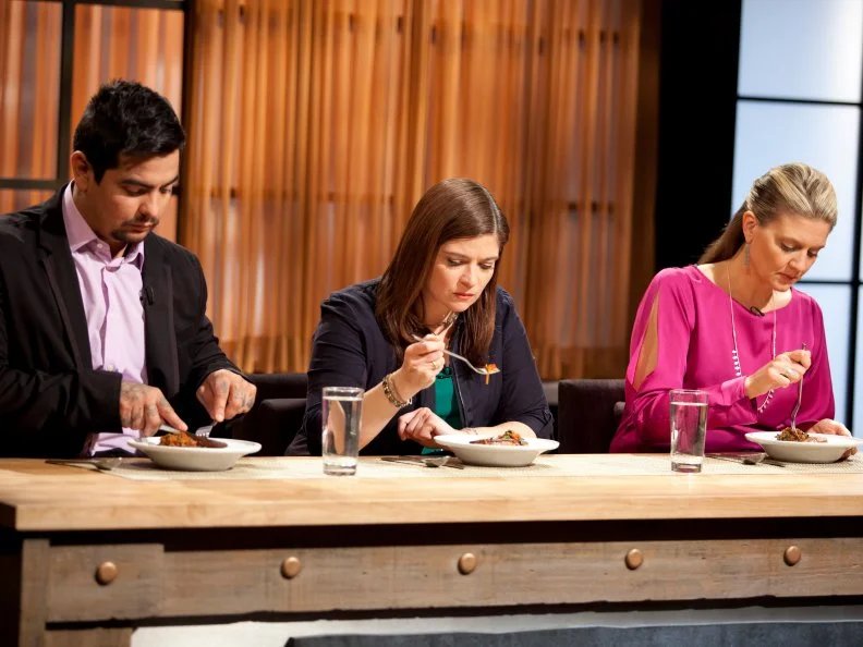 Judges Aaron Sanchez, Alex Guarnaschelli and Amanda Freitag taste dishes, as seen on Food Network’s Chopped Champions, Season 14.
