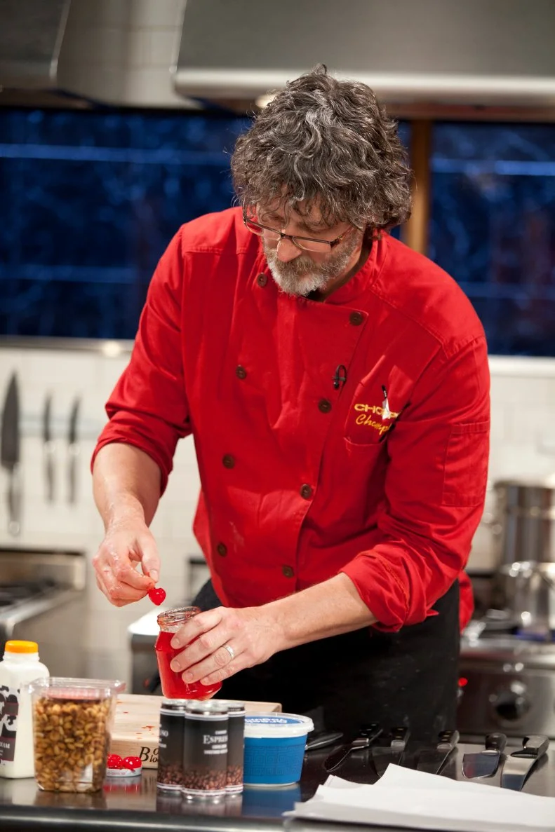 Chef Rob Evans works with maraschino cherries, as seen on Food Network’s Chopped Champions, Season 14.