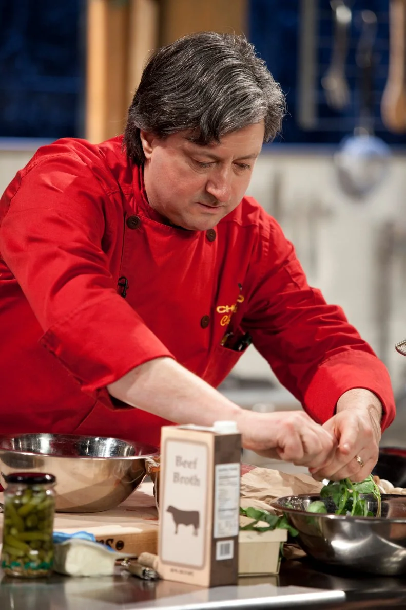 Chef Jean-Louis Gerin works with greens, as seen on Food Network’s Chopped Champions, Season 14.
