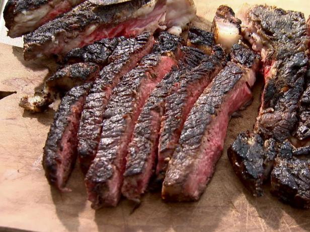 ribeye steak on charcoal grill