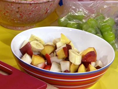 A bowl of freshly prepared sliced fruit.