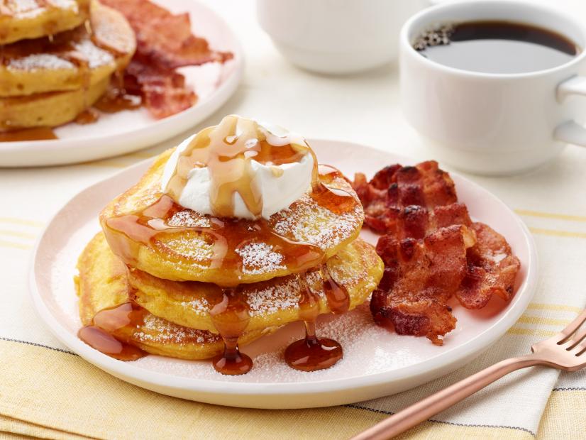 Anne Burrell's Orange Pumpkin Pancakes with Vanilla Whipped Cream, Cinnamon Maple Syrup and Thick-Cut Bacon for the Best of the Worst episode of Worst Cooks in America, as seen on Food Network.