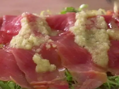 smoked Salmon and Frisee Carpaccio is served.