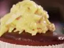 A German Chocolate Cupcake is served.