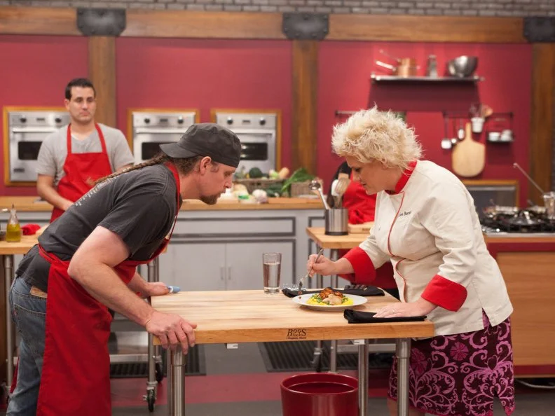 Red Team Leader Chef Anne Burrell tastes Recruit Robert Tamke's "Checkenalahoto" prepared for the "Extreme Flavor Challenge" as seen on Food Network's Worst Cooks in America, Season 3.