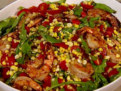 Grilled shrimp and corn salad is served as a side dish.