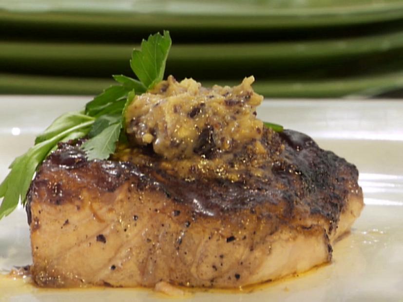 Grill salmon is served with a relish topping and cilantro.