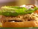 Catfish sandwich with lettuce prepared by Sunny Anderson. 