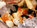 Stone crab legs resting in ice until they will be cooked.