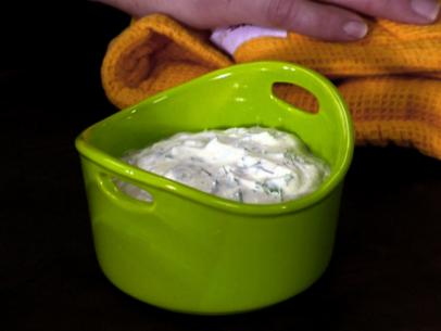 Homemade ranch dressing is served in a green bowl.