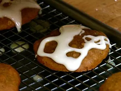 Icing is drizzled over sweet potato cookies.