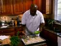 Chef Aaron McCargo spreads an egg wash of the pastry shells.