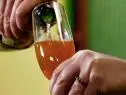 Wine is poured into a glass.
