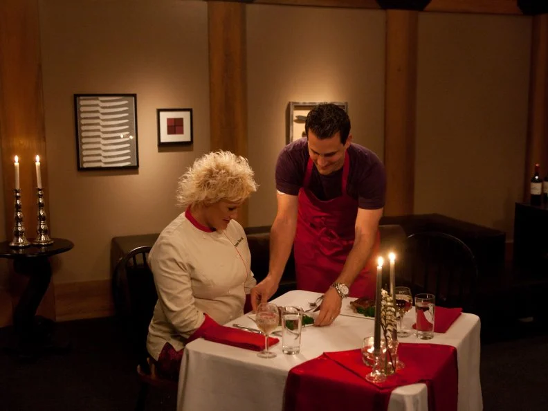 Worst Cooks In America Red Team Leader Chef Anne Burrell tastes Recruit Anthony Schiano's Poussin al Mattone and Brocclirabe for the Date Night Challenge as seen on Food Network's Worst Cooks in America, Season 3.