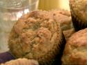 A close up of brown butter banana muffins in paper cups.