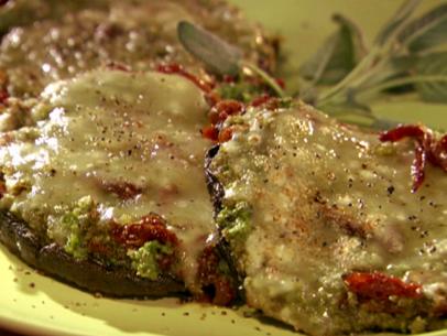 Grilled portobello mushrooms that were stuffed with a pesto, cheese, sundried tomatoes, and bread crumb filling and topped with mozzarella cheese.