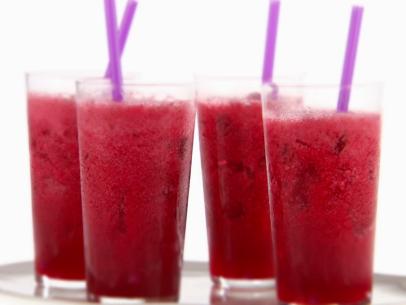 Four glasses of berry lemonade made with berries, lemonade concentrate and vanilla simple syrup.