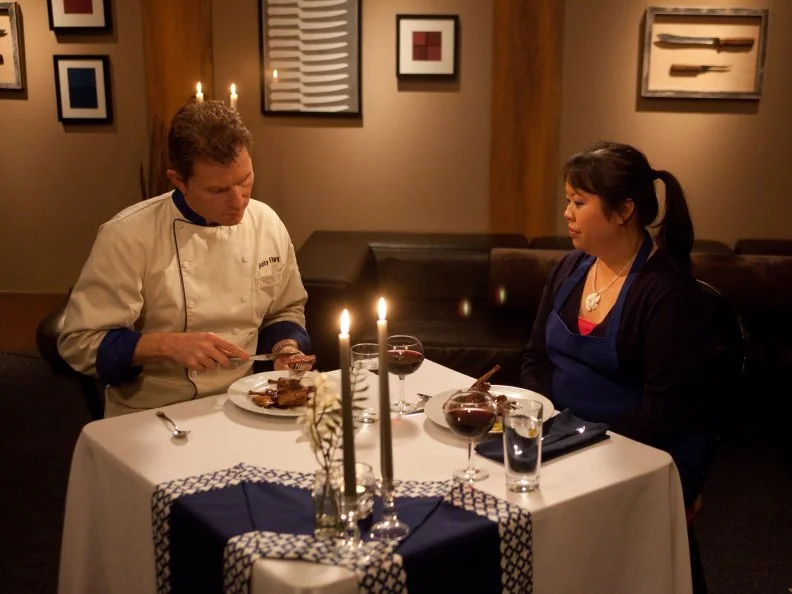 Worst Cooks In America Blue Team Leader Bobby Flay tastes Recruit Sarina Weeraprajuk's Butterflied Squab with Piquillo Pepper Sauce and Apple Crisp for the  "Date Night" main dish challenge as seen on Food Network's Worst Cooks in America, Season 3.