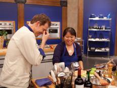 Worst Cooks In America Blue Team Leader Bobby Flay checks in with Recruit Sarina Weeraprajuk as she prepares Butterflied Squab with Piquillo Pepper Sauce and Apple Crisp for the  "Date Night" main dish challenge as seen on Food Network's Worst Cooks in America, Season 3.