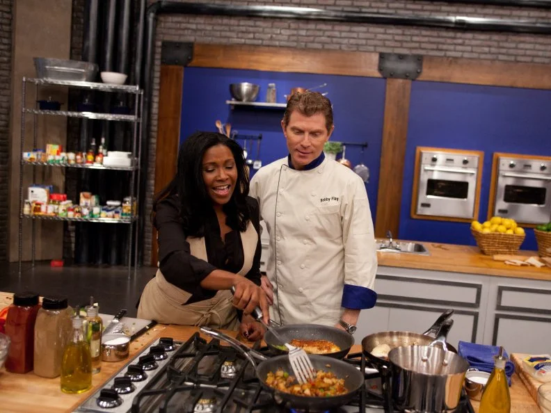 Worst Cooks in America Team Leader Chef Bobby Flay checks in with recruit Kelli Powers as she prepares a favorite dish for the "Show Us Your Stuff"  challenge, as seen on Food Network's Worst Cooks in America, Season 3.