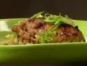 A bowl of Roasted Garlic Chicken in Casserole with Israeli Couscous is served.