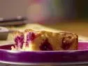 A slice of plum cornbread is served.