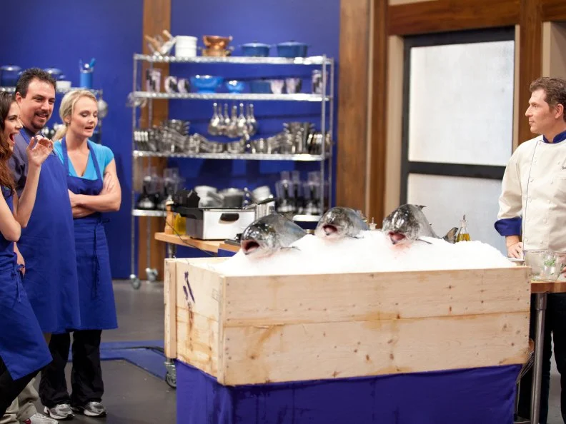 Chef Bobby Flay reveals the fish to the Blue Team for the Everything Seafood Challenge as seen on Food Network's Worst Cooks in America, Season 3.