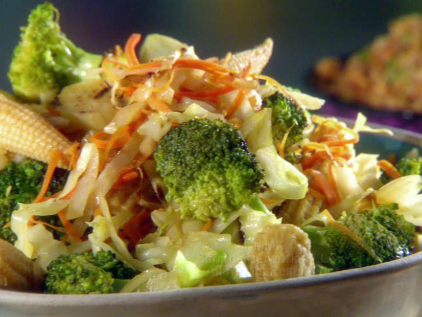 A dish of quick veggie stir fry made with broccoli, shredded vegetables, and baby corn