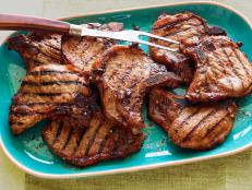 Sunny Anderson uses a quick marinade to ensure super juicy and flavorful grilled pork chops with minimal effort.