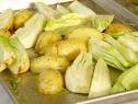 All vegetables are chopped  and placed on the roasting pan.