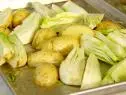 All vegetables are chopped  and placed on the roasting pan.
