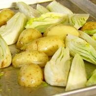 All vegetables are chopped  and placed on the roasting pan.