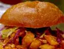 Rachael Ray's slow cooked bbq pulled chicken on a roll with homemade slaw salad.