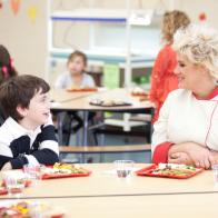 Chef Anne Burrell and elementary school students taste the healthy and kid-friendly cafeteria food made by the recruits in the Cooking for Kids Challenge as seen on Food Network's Worst Cooks in America, Season 3.