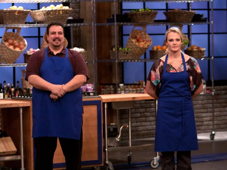 Worst Cooks In America Team Blue Team Recruits Vinnie Caligiuri and Melissa Rhodes waiting for details on the  "Loved Ones" challenge as seen on Food Network's Worst Cooks in America, Season 3.