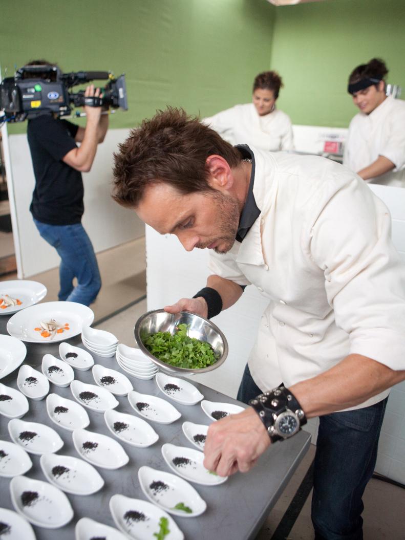 Contestant Josh Lyons of Team Giada plating for their restaurant "Blu" in the Star Challenge "Restaurant Impossible" as seen on Food Network's Star, Season 8.