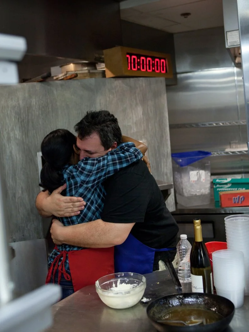 Worst Cooks in America Red Team Recruit Kelli Powers  and Blue Team Recruit Vinnie Caligiuri congratulate one another after they both finish preparing a 3 course meal on time for the season finale as seen on Food Network's Worst Cooks in America, Season 3.