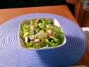 A bowl of zucchini ribbon salad is served.