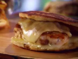 Chicken chorizo patty melts are served on a cutting board.