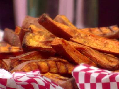 A basket of sweet potato fries is served.