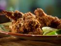 A close up of a plate of Sunny Anderson's chile-lime fried chicken.