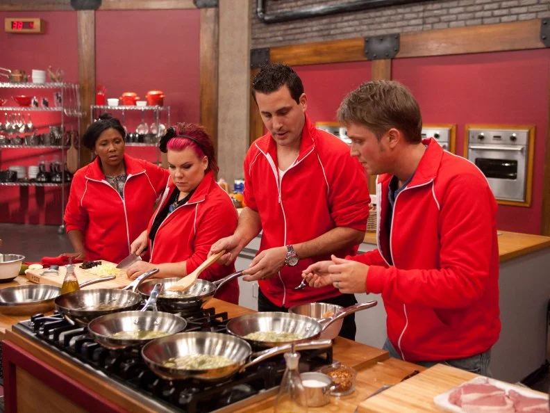 Worst Cooks In America Team Red Team Recruits Anthony Schiano, Dorothy Strouhal, Kelli Powers and David Shelton work together to figure out how to make Chef Annes unidentified dish: Prune and Apple Stuffed Pork Chop with Apple Cider Reduction, Yukon Gold and Carrot Mash with Sauteed Broccoli Rabe for  the "Taste and Remake" challenge as seen on Food Network's Worst Cooks in America, Season 3.
