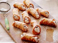 Alex Guarnaschelli's Homemade Cannoli remind her of coffee breaks in Manhattan. Best with a cup of joe, these crisp Italian shells are filled with spiced cream.