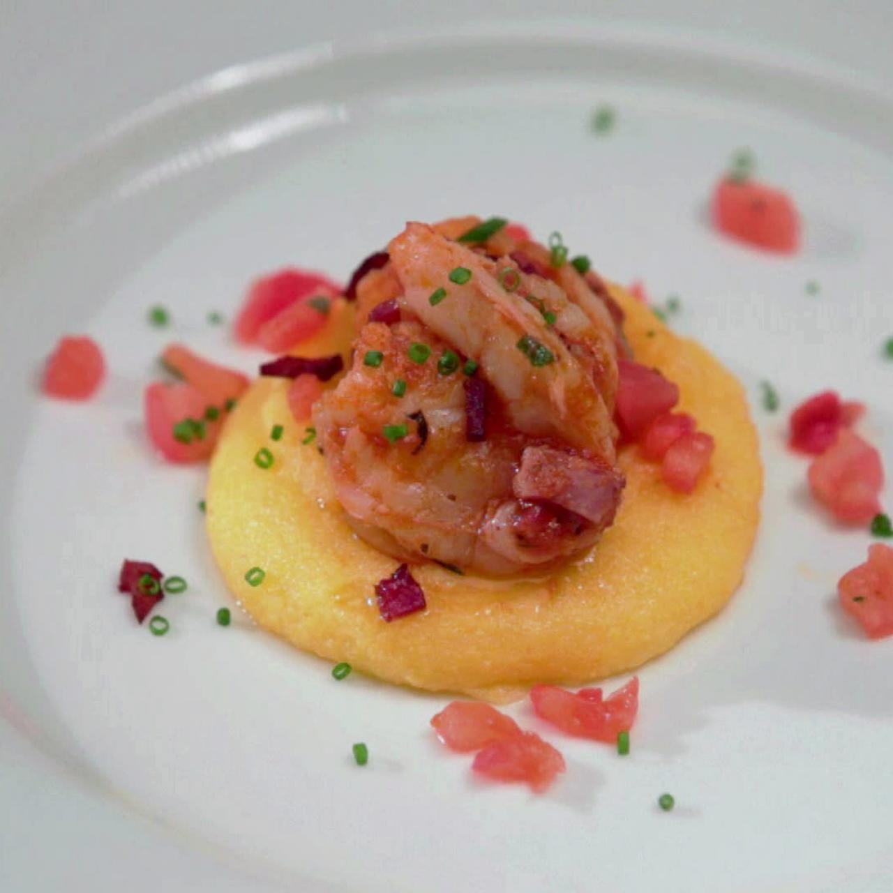 https://food.fnr.sndimg.com/content/dam/images/food/fullset/2012/5/18/0/NF0801H_lola-shrimp-and-parmesan-polenta-grits-with-tomato-basil-concasse_s4x3.jpg.rend.hgtvcom.1280.1280.suffix/1371607211642.jpeg