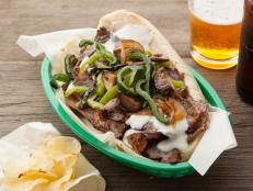 For a cheesesteak that takes you all the way to Philly right in your kitchen, you're in good hands with Bobby Flay's recipe. Though it has a few components, once you assemble that gorgeous mess of a sandwich you'll be glad you did.