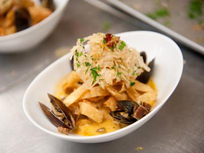 Team Alton's Contestant Judson Allen's "Seafood Bouillabaisse inspired Lemon infused Pasta w/ Garlic Cream Sauce" makeover of "bland" dish Seafood Alfredo for the Star Challenge "Fashion Week: Taking a Risk" in Episode 4, as seen on Food Network's Star, Season 8.