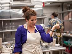 Contestant Martita Jara of Team Giada cooking for the Star Challenge "Fashion Week: Taking a Risk" in Episode 4, as seen on Food Network's Star, Season 8.