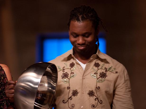 Contestant Malcolm Mitchell of Team Bobby unveiling his "bland" dish to makeover at the Reveal of the Star Challenge "Fashion Week: Taking a Risk" in Episode 4, as seen on Food Network's Star, Season 8.