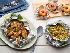 Coming up with 50 of anything for Food Network Magazine’s monthly 50-recipe booklet can be daunting but this month, chefs in Food Network Kitchens tackled the ultimate way to cook out: in foil packs.