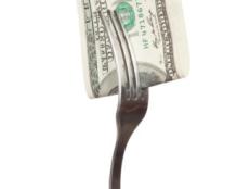 fork with hundred dollar bill close up